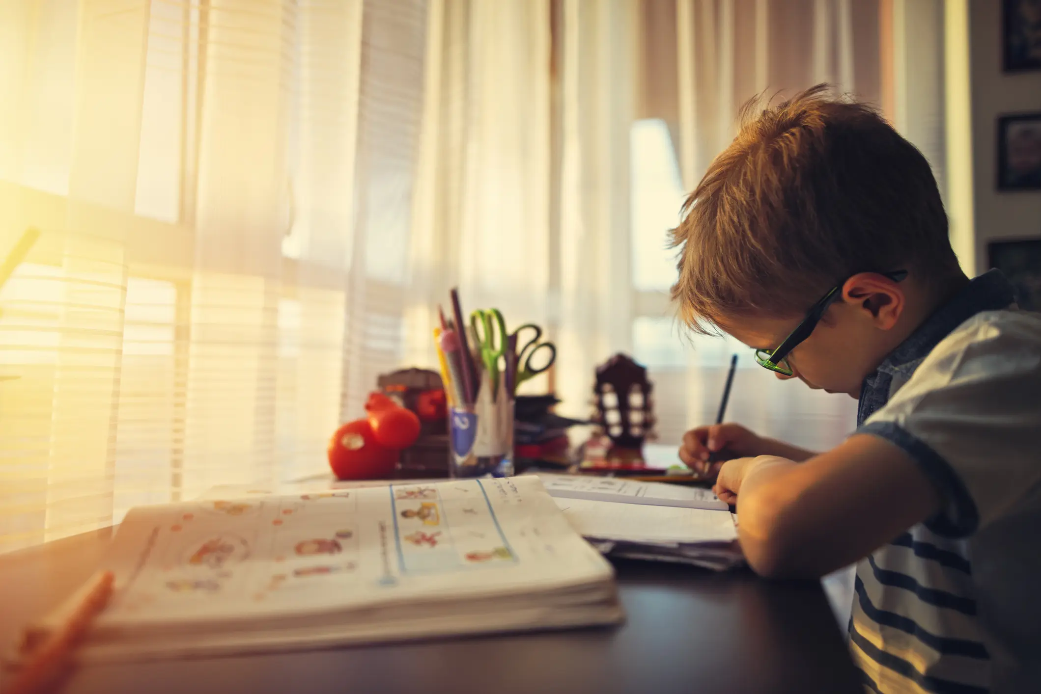 Little boy doing homework at home