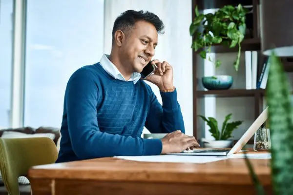 Man at computer smiling