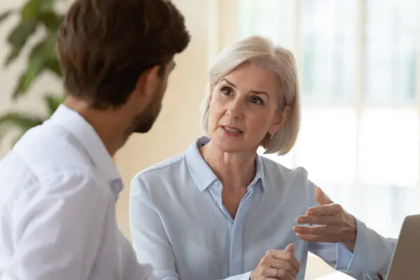 Woman lawyer talking to client