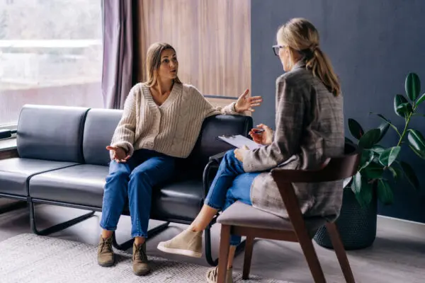 Woman speaking to divorce coach in an office
