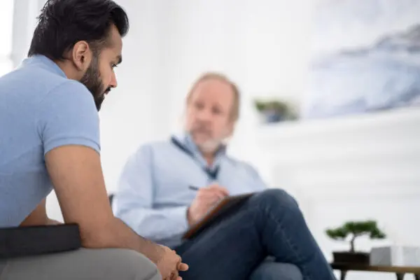 Man talking to divorce coach