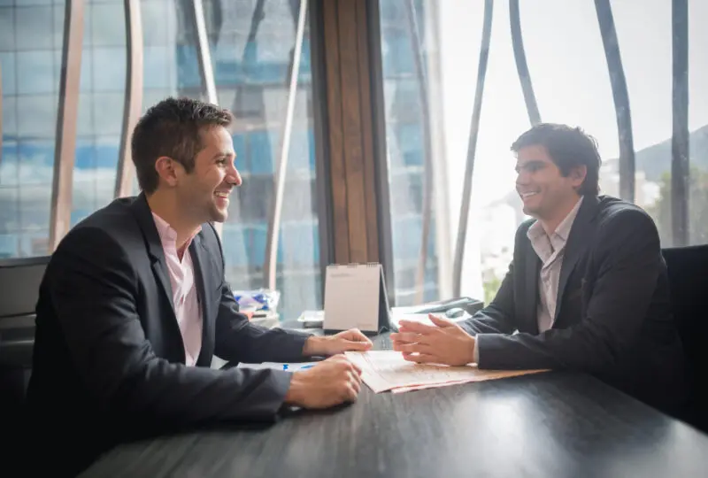A man meeting his attorney in an office building