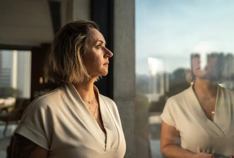 women looking out a window