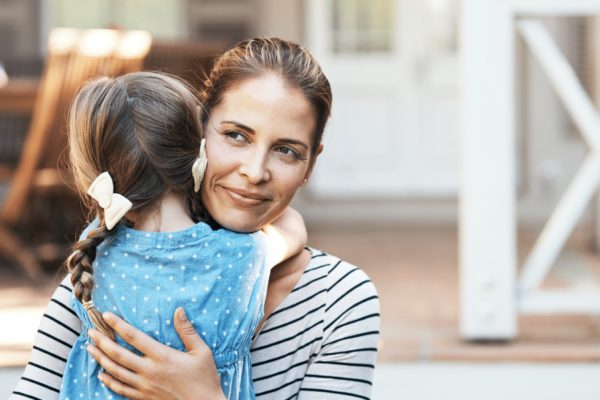 Mother hugging her child