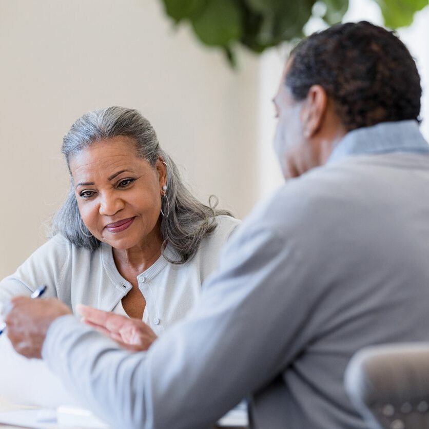 woman meeting with her attorney at a table