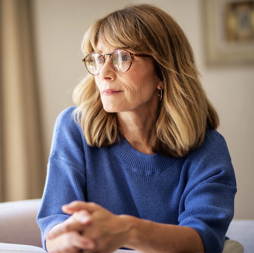 middle-aged woman looking off into the distance