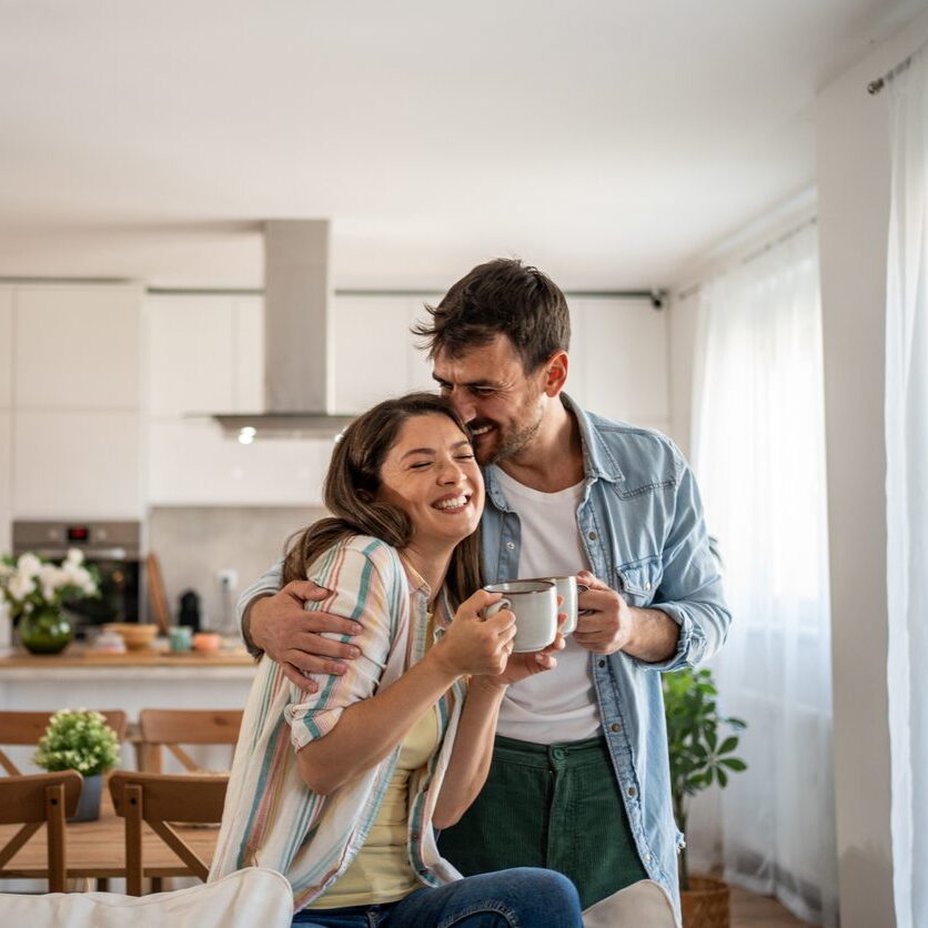 young couple at home drinking coffee