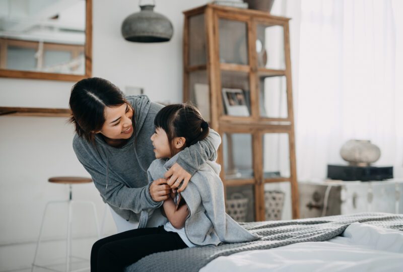 Mother hugging her daughter