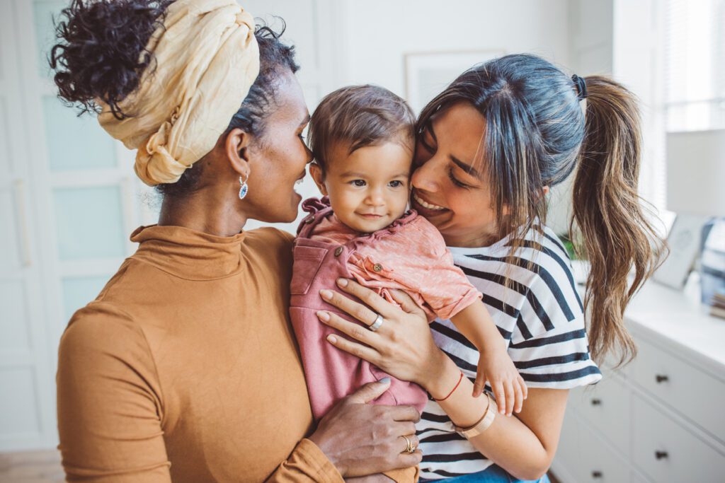 Mothers holding their baby