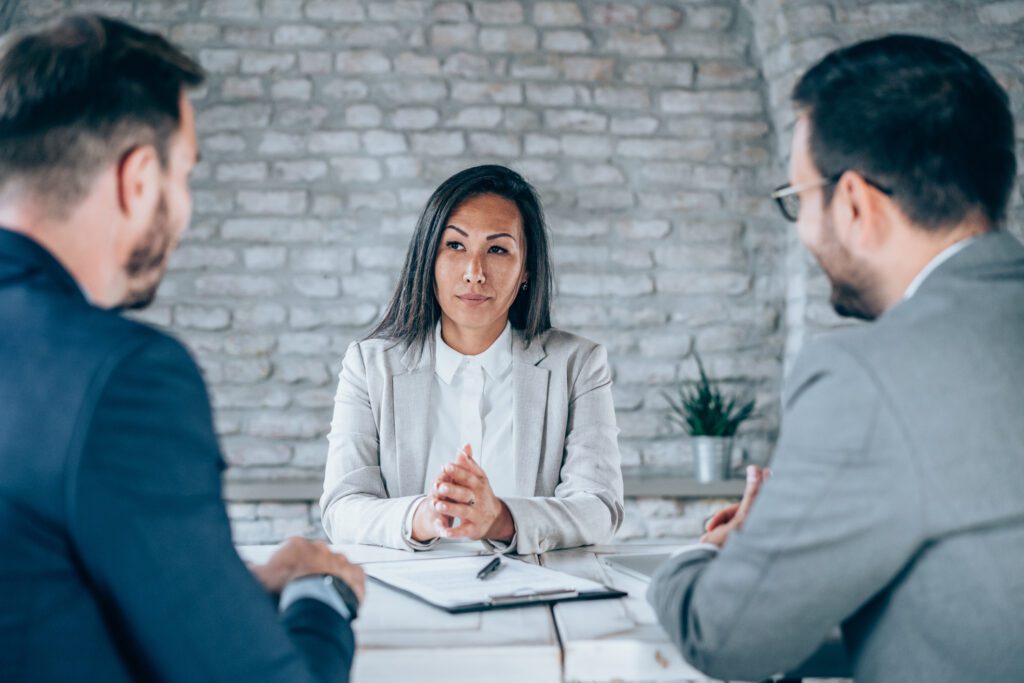 three people in a business meeting