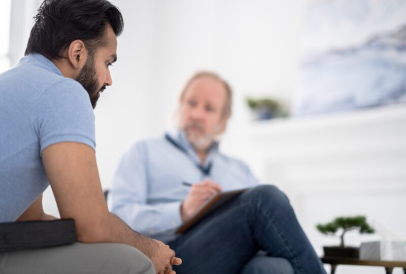 Man talking to divorce coach