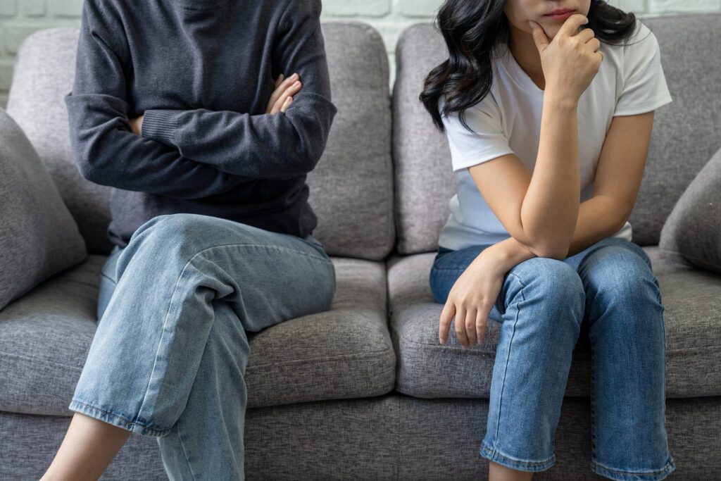 LGBT couple sitting on therapist couch