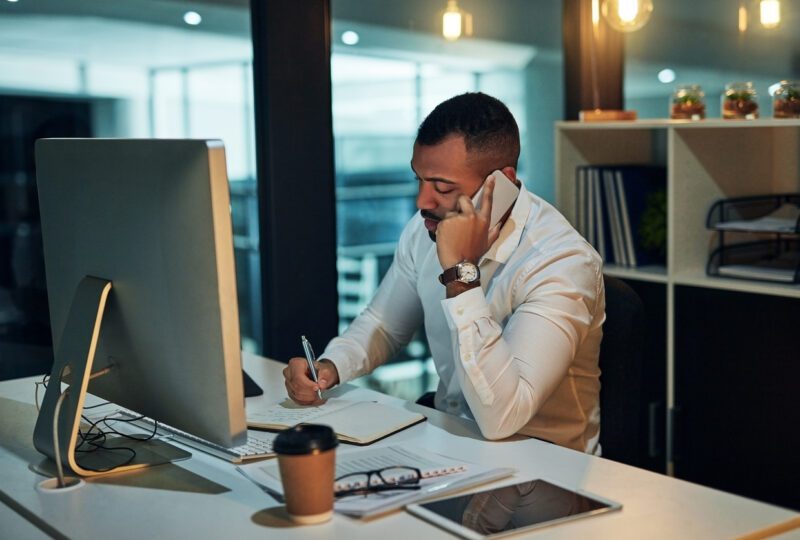 business man in office talking on phone