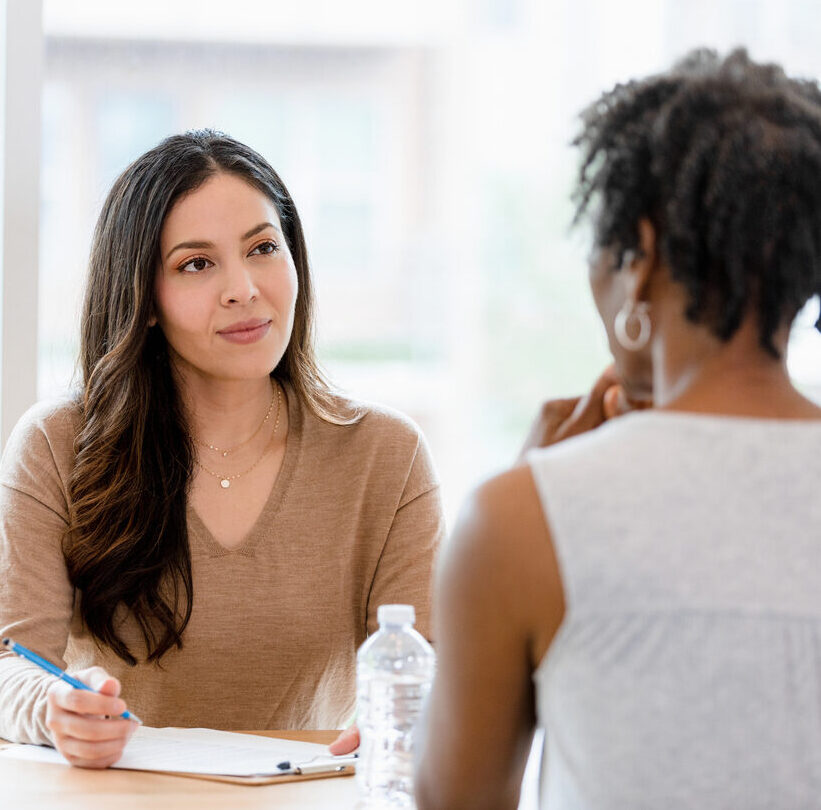 Woman therapist meeting with client