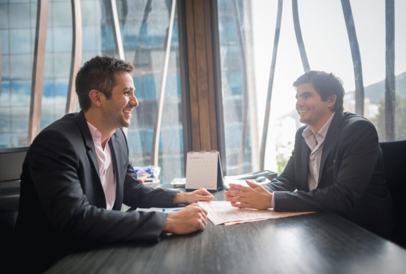 A man meeting his attorney in an office building