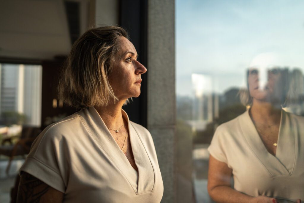 women looking out a window