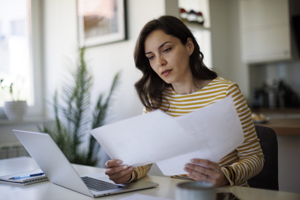 woman looking at papers