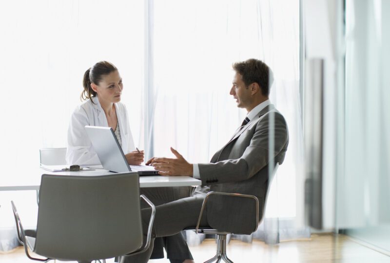 client meeting with their attorney sitting at table