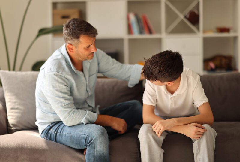 parent having serious conversation with child