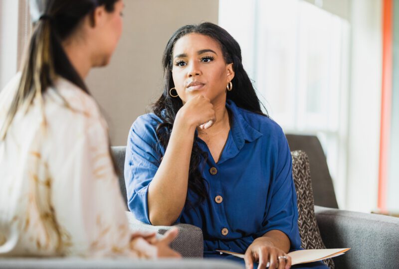 therapist and female client in a therapy session