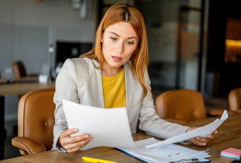 woman looking at paperwork