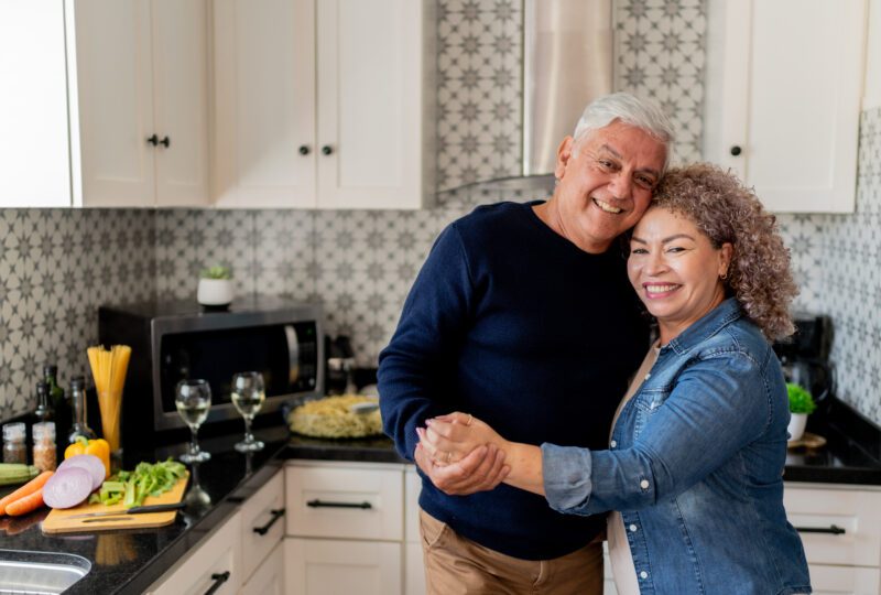 man and woman cooking in kitchen