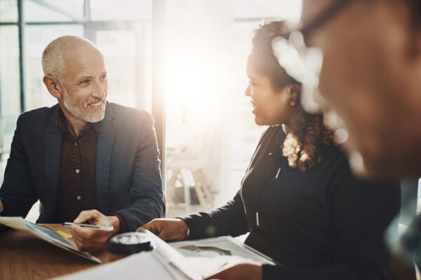 a divorce coach sitting at a table with a client