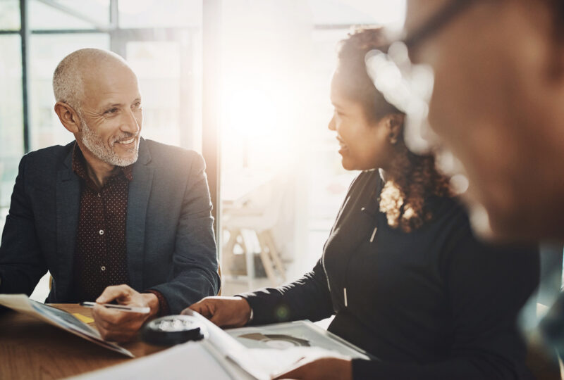 a divorce coach sitting at a table with a client