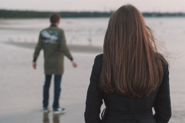 married couple walking away from eachother