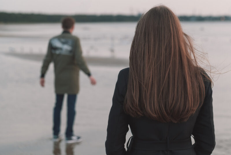 married couple walking away from eachother